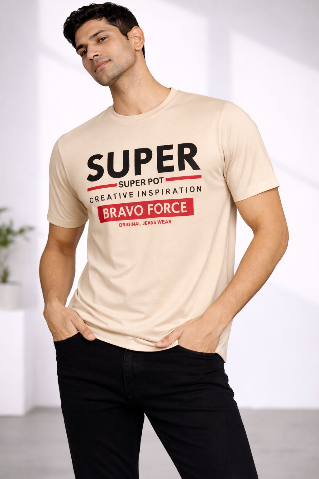 Man wearing the Amaurya Fashion beige Super Bravo Force graphic T-shirt with black jeans