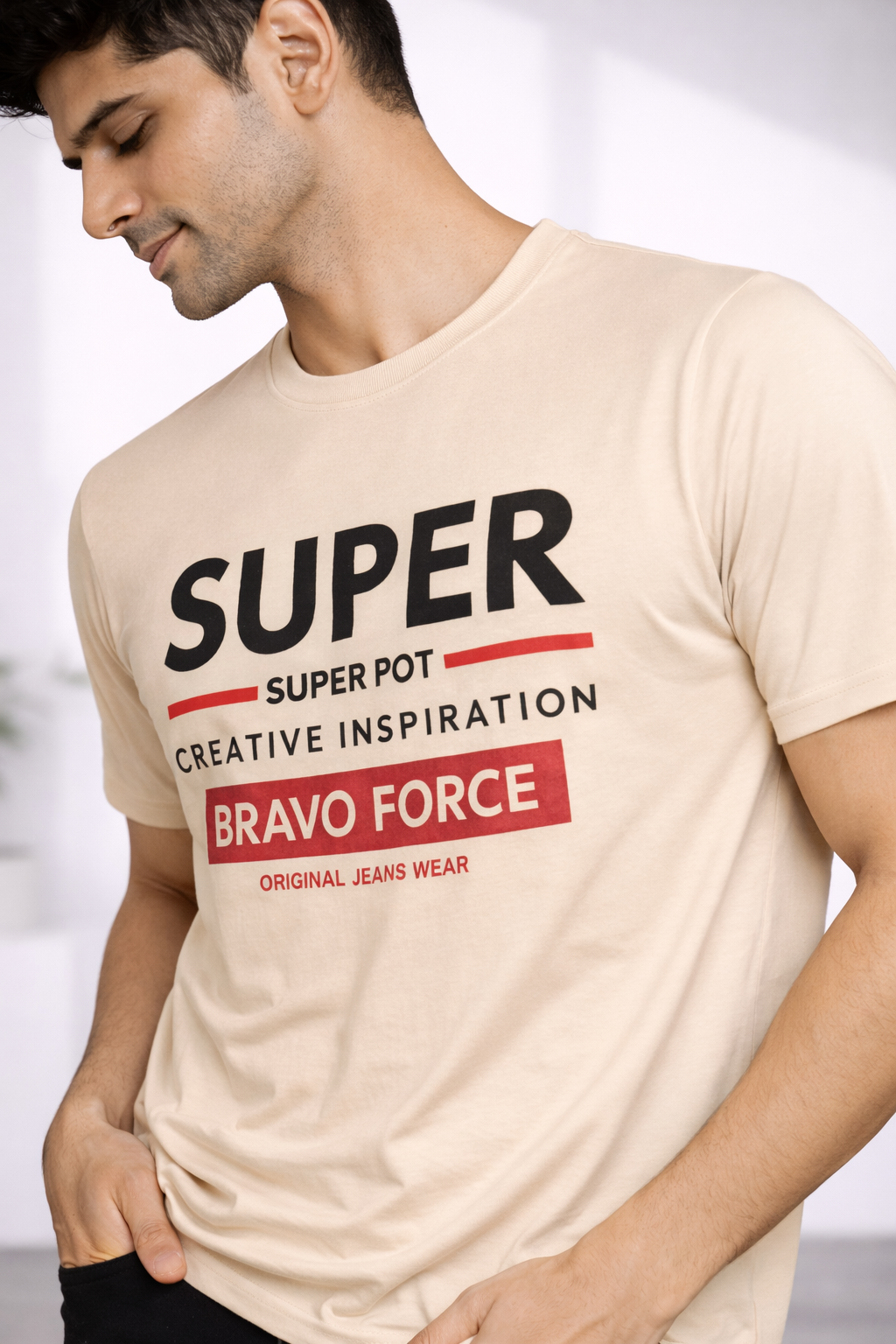 Close-up of the Super Bravo Force print on the beige Amaurya T-shirt